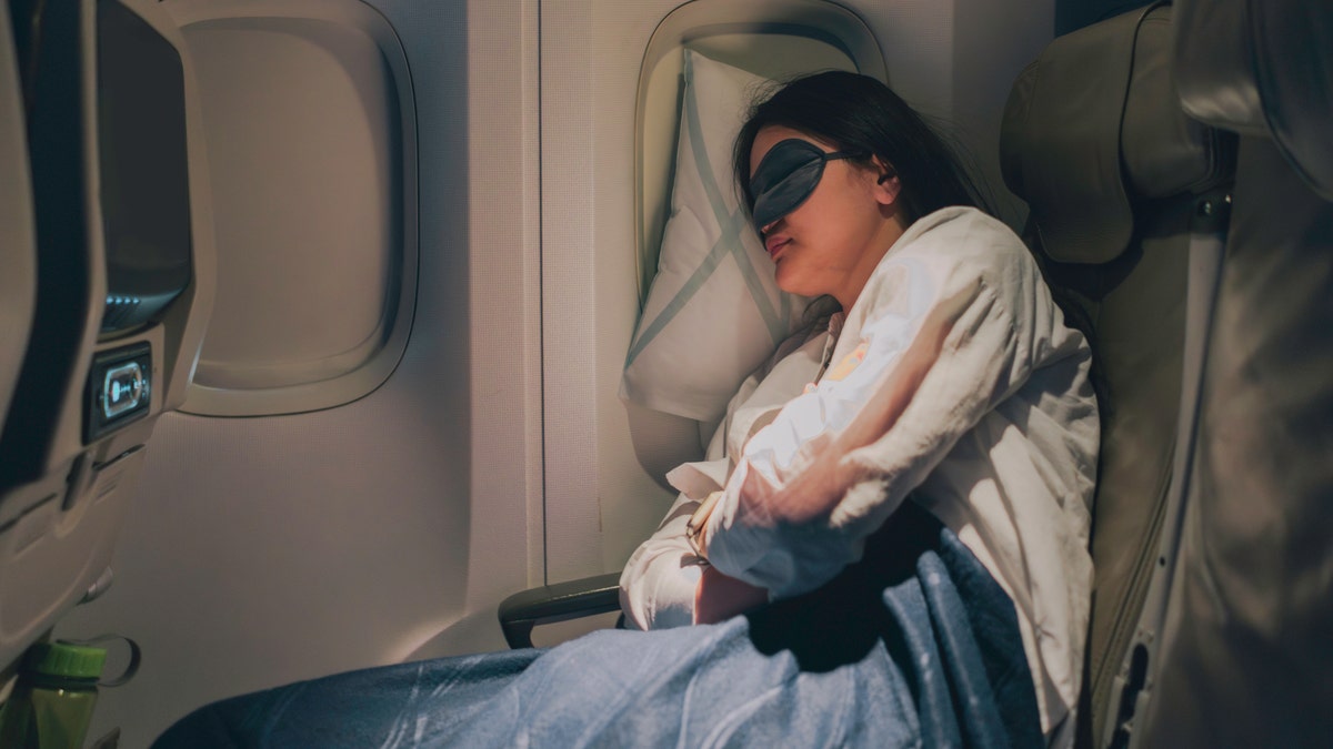 Woman sleeping on airplane