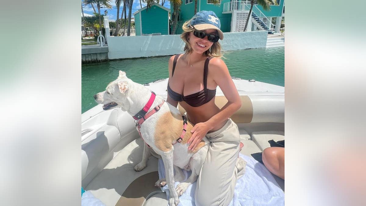 Sydney Sweeney on a boat with her dog