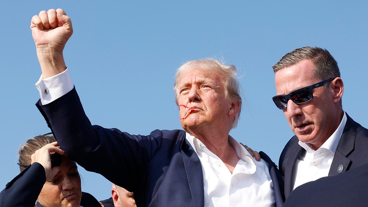 Trump with fist raised after his was shot