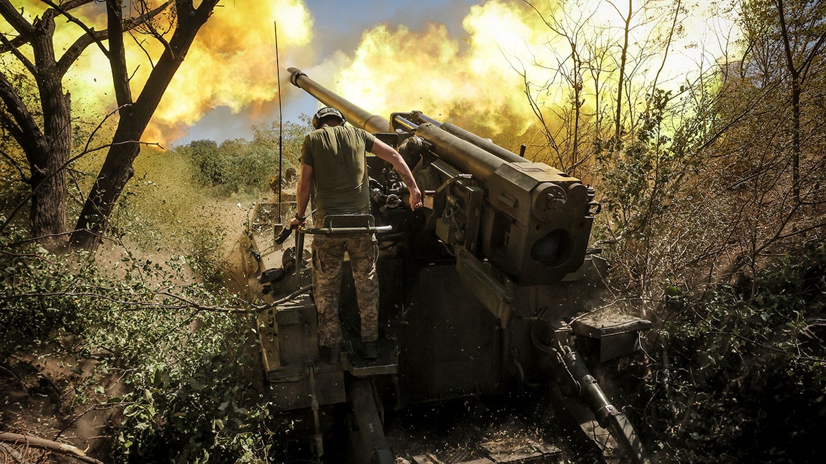 Servicemen of the 24th Mechanised Brigade fire a" Giatsint-S" 152mm self-propelled howitzer towards Russian positions near Chasiv Yar town, in Donetsk region of Ukraine on Tuesday, Aug. 20, 2024.