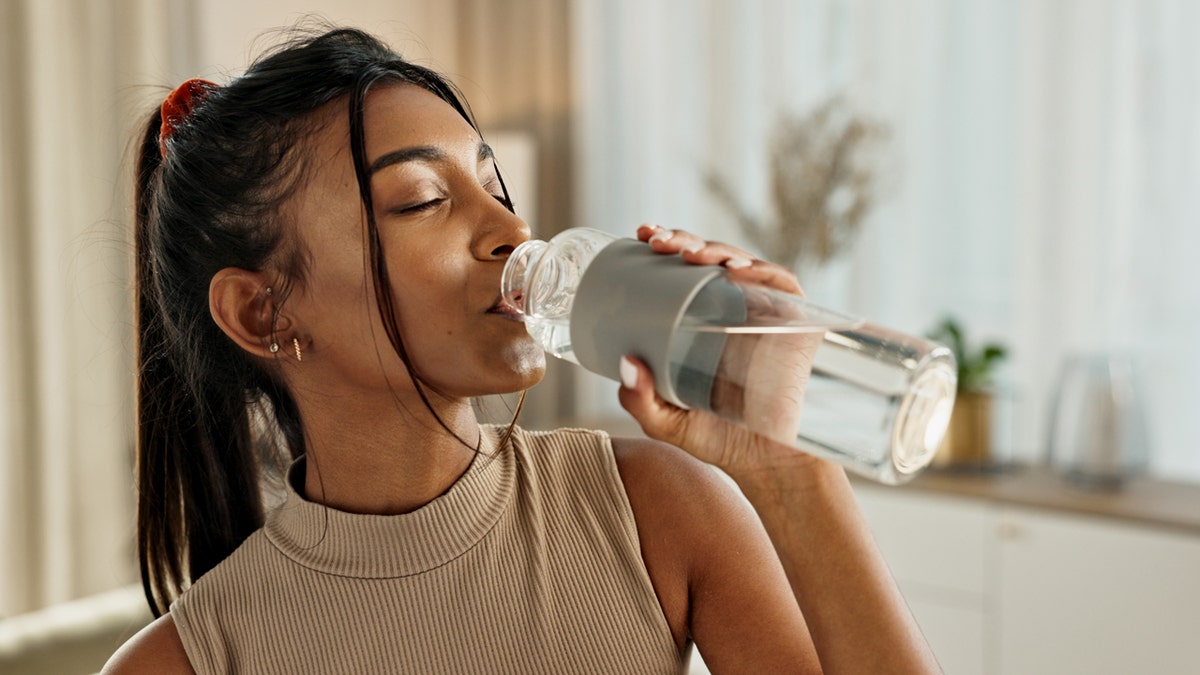 a woman drinking water