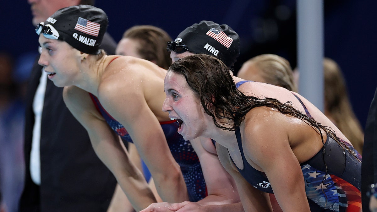 women's team cheering