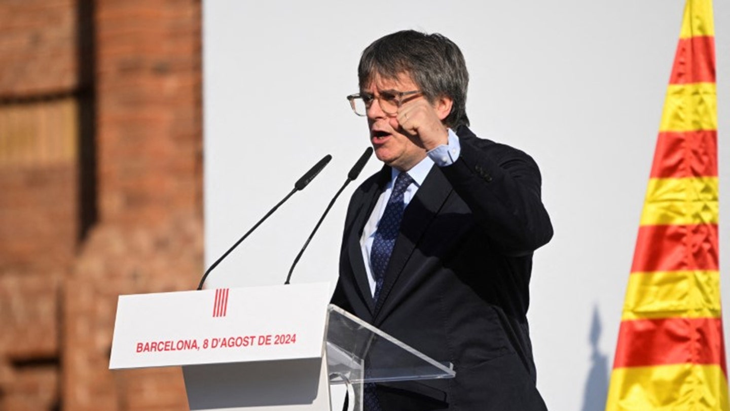 Puigdemont Defies Arrest Warrant, Flees Rally