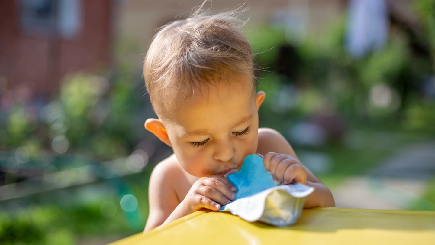 baby eating from pouch