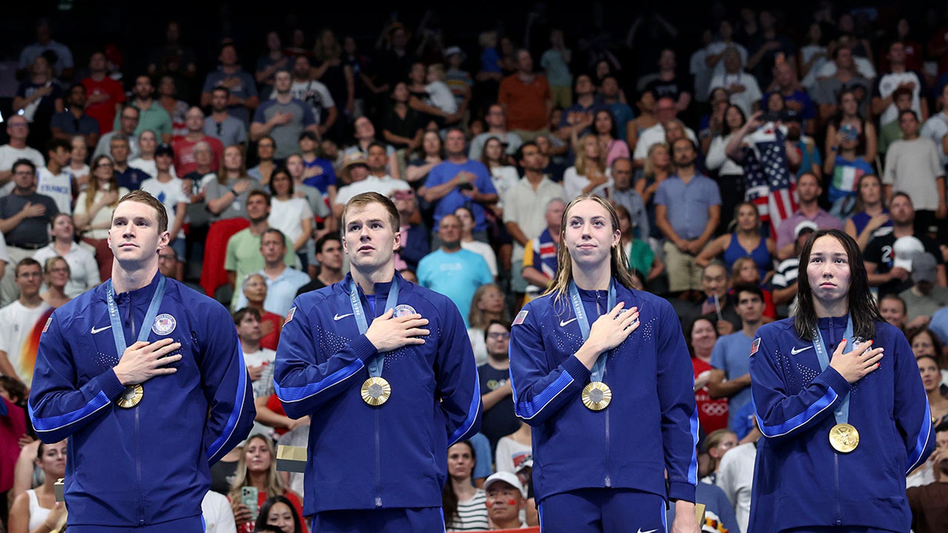 Ryan Murphy, Nic Fink, Gretchen Walsh and Torri Huske pose