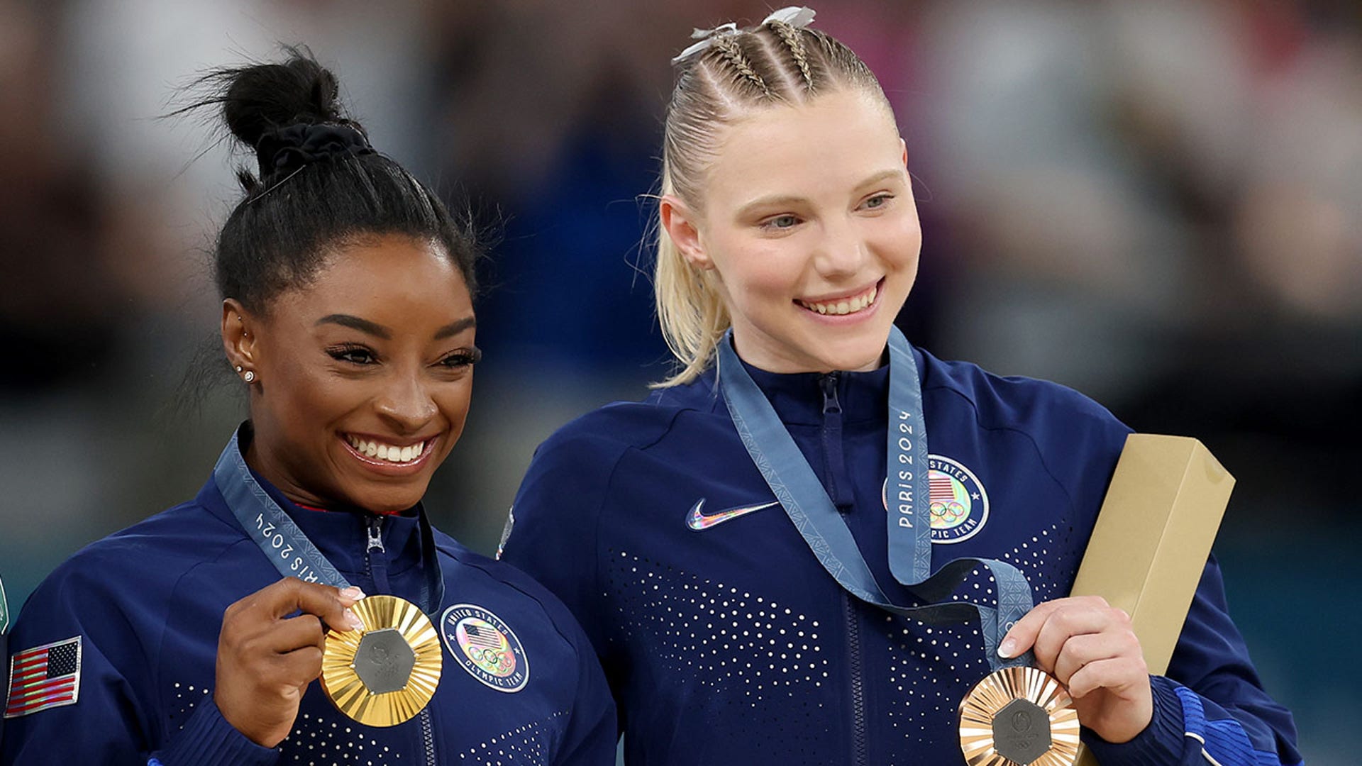 Simone Biles and Jade Carey pose