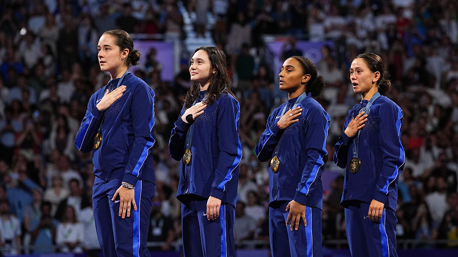 USA fencing team with gold