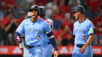 Blue Jays' George Springer screams at umpire after ejection, needs to be held back