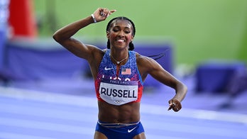 Russell Wins Gold in Thrilling 100-Meter Hurdles Finish, Defeats Samba-Mayela by a Torso