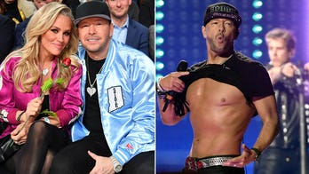 Jenny McCarthy shows off Donnie Wahlberg's abs in shirtless snaps as she celebrates 'hot' husband's birthday