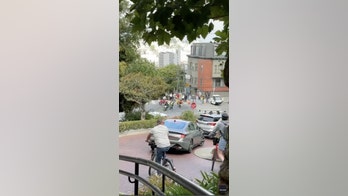 WATCH: San Francisco traffic officer circled by masked motorcyclists in tourist area