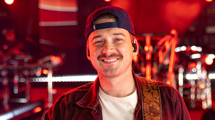 Morgan Wallen irks Taylor Swift fans as he wears Harrison Butker's number, walks with Travis Kelce at show | Fox News