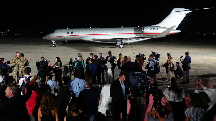 A plane carrying reporter Evan Gershkovich, Alsu Kurmasheva and Paul Whelan arrives at Andrews Air Force Base
