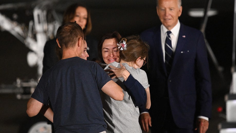 President Joe Biden and Vice President Kamala Harris watch as former prisoner held by Russia US-Russian journalist Alsu Kurmasheva embraces her family