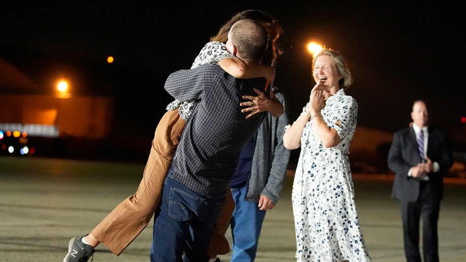 Reporter Evan Gershkovich hugs his mother Ella Milman at Andrews Air Force Base