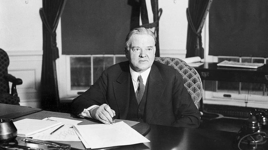 Herbert Hoover at his desk