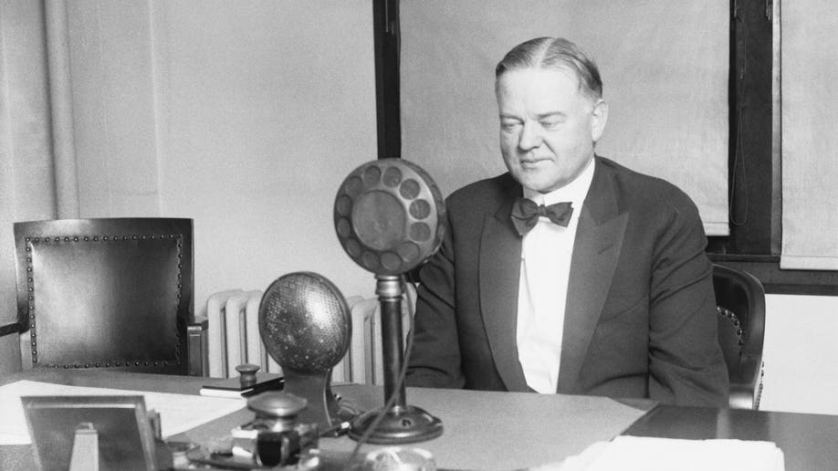 Herbert Hoover speaking into microphone