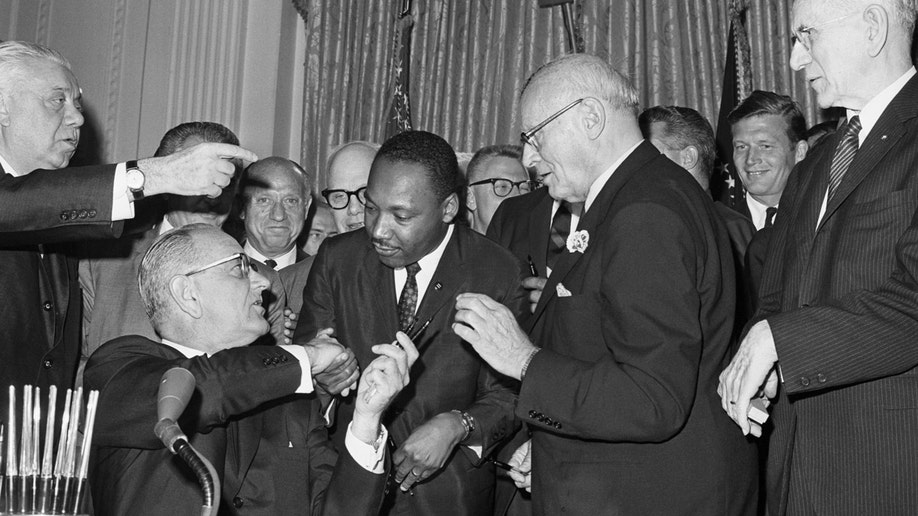 Lyndon B. Johnson signing the Civil Rights Act