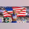 Gabby Thomas celebrates with the American flag