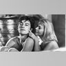 Black and white photo of French actor Alain Delon and American actress Lola Albright