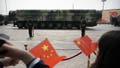 FILE - Spectators wave Chinese flags as military vehicles carrying DF-41 nuclear ballistic missiles roll during a parade to commemorate the 70th anniversary of the founding of Communist China in Beijing on Oct. 1, 2019. - Fox News