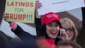 A woman hoods a sign expressing Latino support for Republican presidential candidate Donald Trump at his campaign rally at the Orange County Fair and Event Center, April 28, 2016, in Costa Mesa, California. - Trump is vying for votes in the June 7 California primary election in hope of narrowing the gap to the 1,237 delegates needed to win the Republican presidential nomination. (Photo by DAVID MCNEW / AFP) (Photo by DAVID MCNEW/AFP via Getty Images) - Fox News
