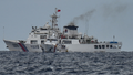 A China Coast Guard ship (background) is seen past the Philippine Coast Guard ship BRP Cape Enga&ntilde;o (front), as photographed from the BRP Cabra during a supply mission to Sabina Shoal in disputed waters of the South China Sea on August 26, 2024. - Fox News