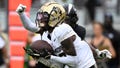 Colorado wide receiver Travis Hunter (12) catches a pass in the end zone for a 23-yard touchdown with Central Florida defensive back Brandon Adams behind him during the first half of an NCAA college football game, Saturday, Sept. 28, 2024, in Orlando, Fla. - Fox News