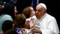 A child kisses Pope Francis during the weekly general audience, in Paul VI hall at the Vatican, August 21, 2024. REUTERS/Yara Nardi     TPX IMAGES OF THE DAY - Fox News