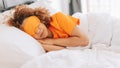 woman wearing sleep mask lying peacefully under the bed sheets - Fox News
