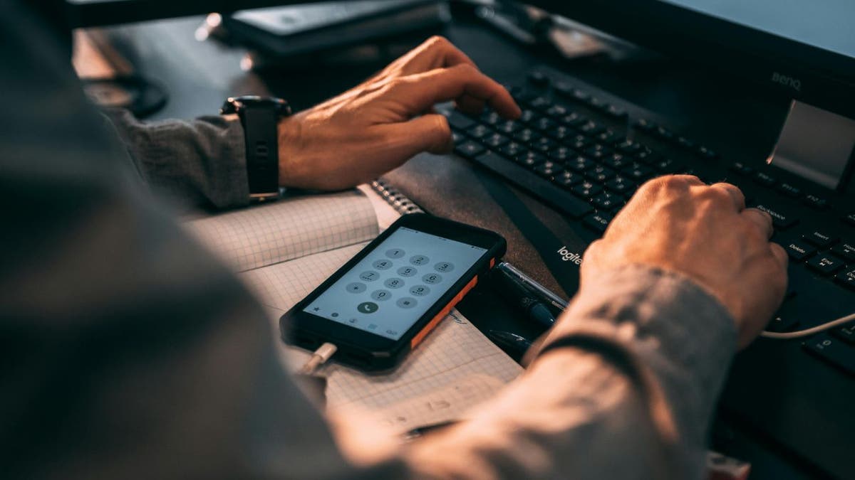 The dangerous intersection of people search sites and scams 1 iphone and keyboard