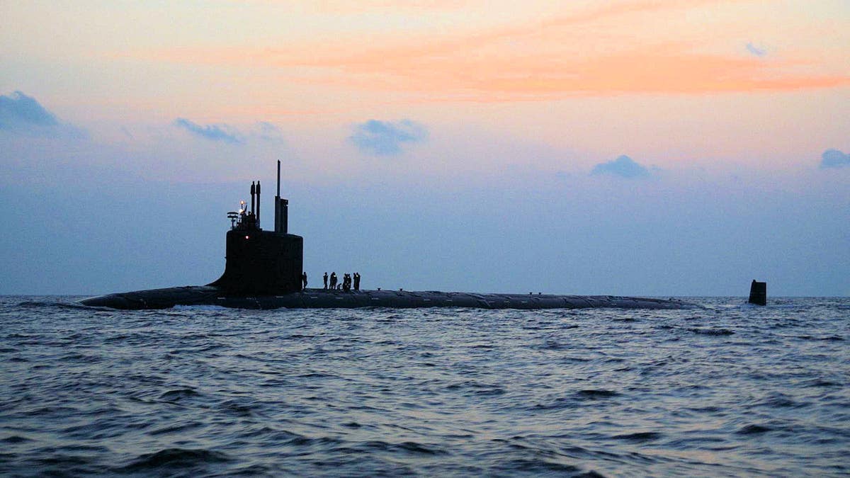 The nation's newest and most advanced nuclear-powered attack submarine PCU Virginia (SSN 774) travels along the morning sunrise skyline on its way from Norfolk Naval Shipyard to complete Bravo sea trials. Virginia is the Navy's only major combatant ready to join the fleet that was designed with the post-Cold War security environment in mind and embodies the war fighting and operational capabilities required to dominate the littorals while maintaining undersea dominance in the open ocean.
