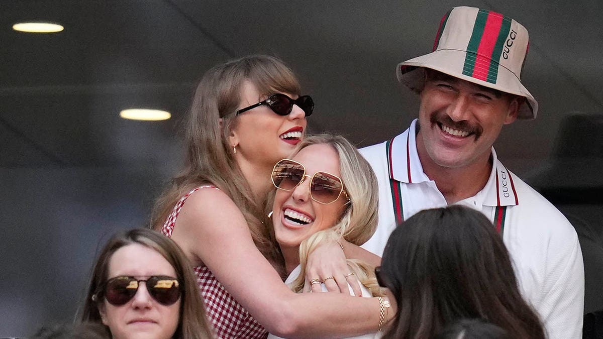 Taylor Swift and Brittany Mahomes hug