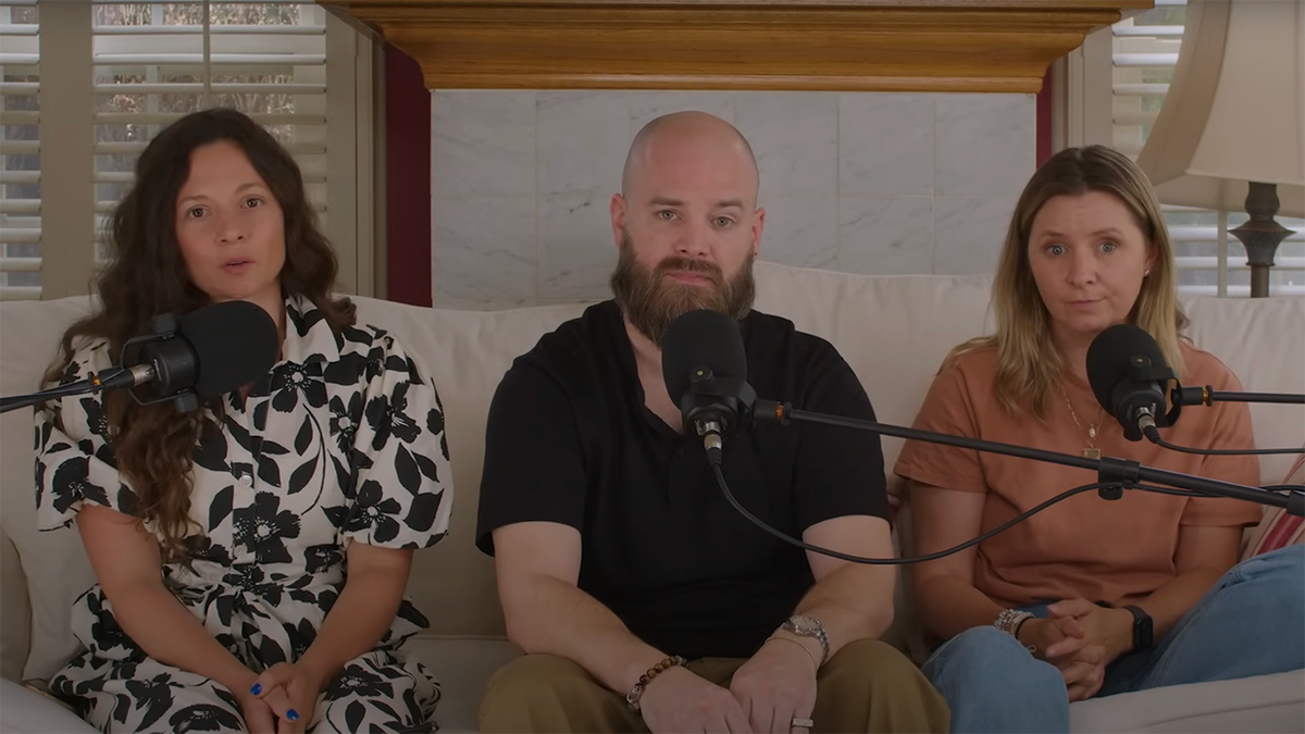 Mackenzie Rosman, Matt Gallagher and Beverley Mitchell sit on a couch in front of three podcast microphones