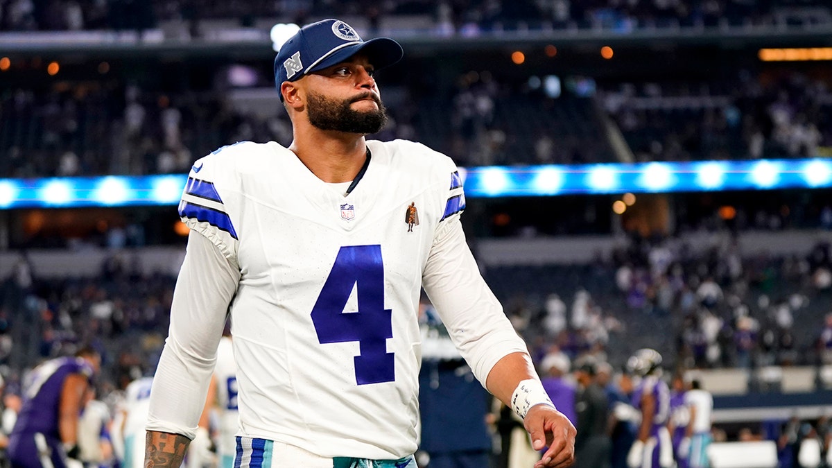 Dak Prescott walks disconnected  the field