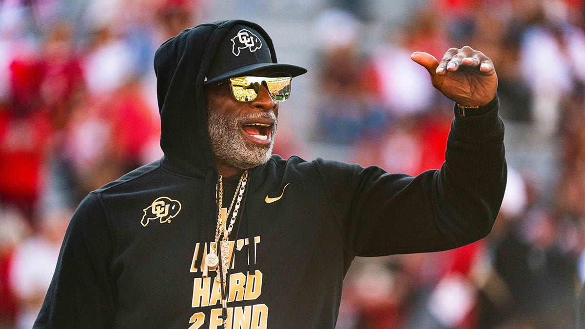 Deion Sanders yells on field