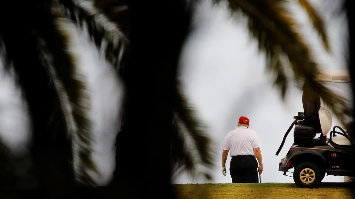 Donald Trump plays golf at Trump International Golf Club in West Palm Beach