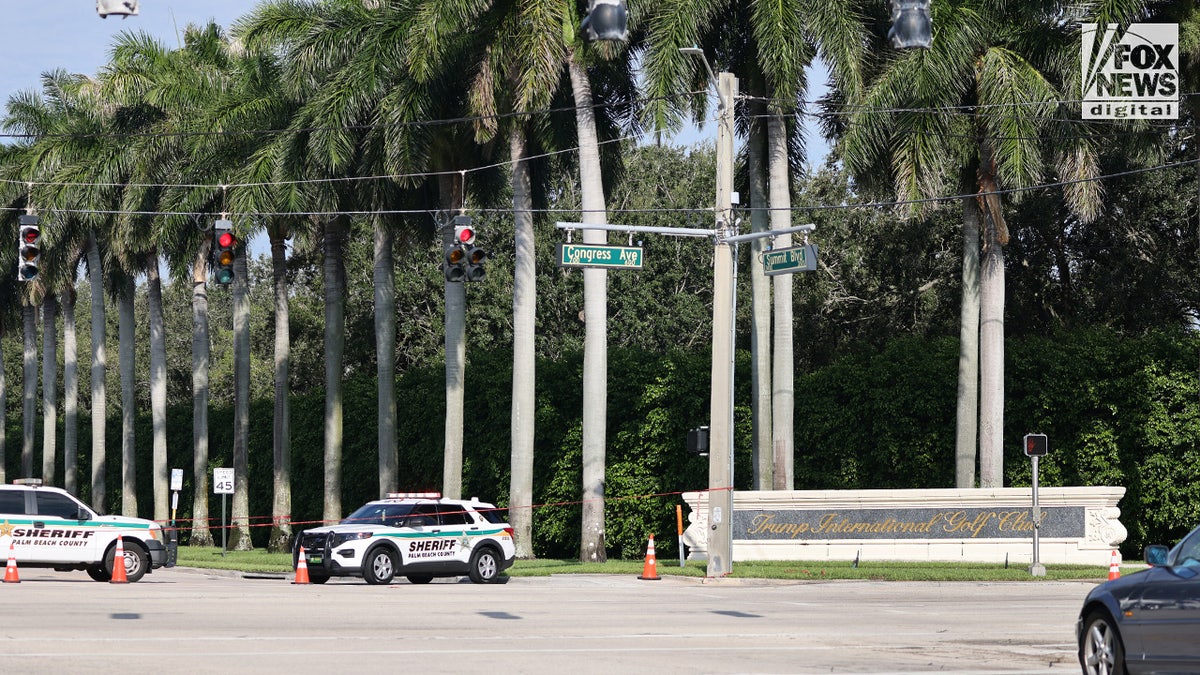 Members of the Palm Beach County Sheriff's Department patrol outside the Trump International Golf Club