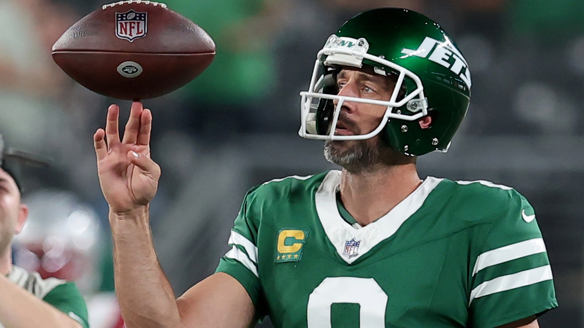 Aaron Rodgers spins the football on his fingers