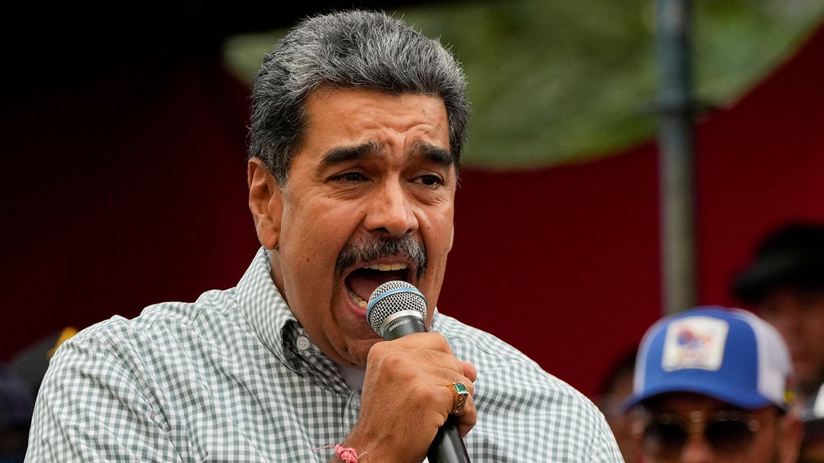 Maduro speaking into a microphone