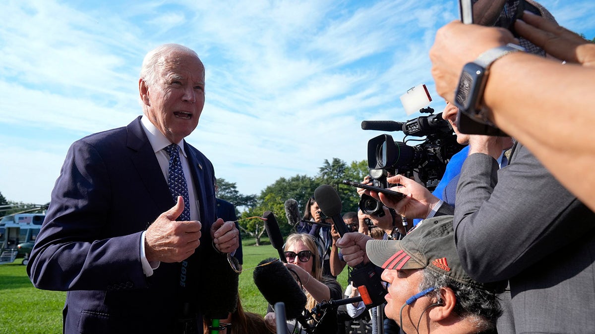 Biden speaks to reporters outside the White House