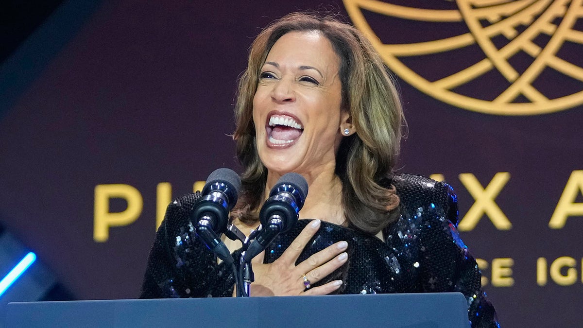 Harris smiles on stage at the Congressional Black Caucus dinner