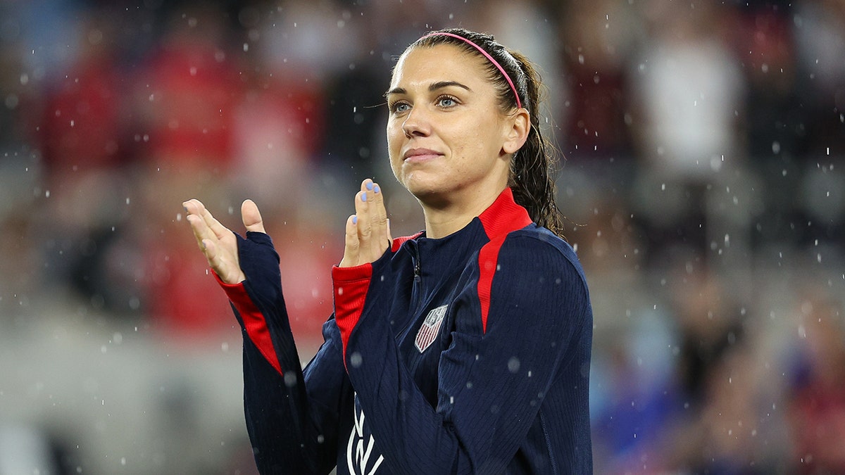 Alex Morgan reacts during a football match