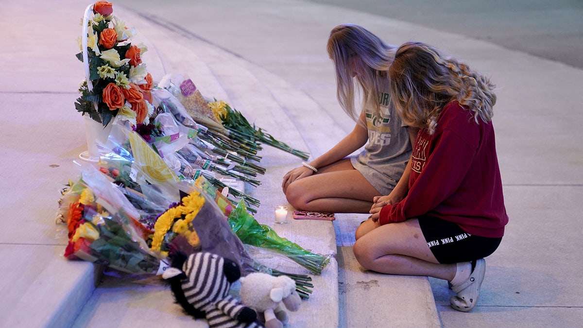 People attend a vigil at Jug Tavern Park following a shooting at Apalachee High School