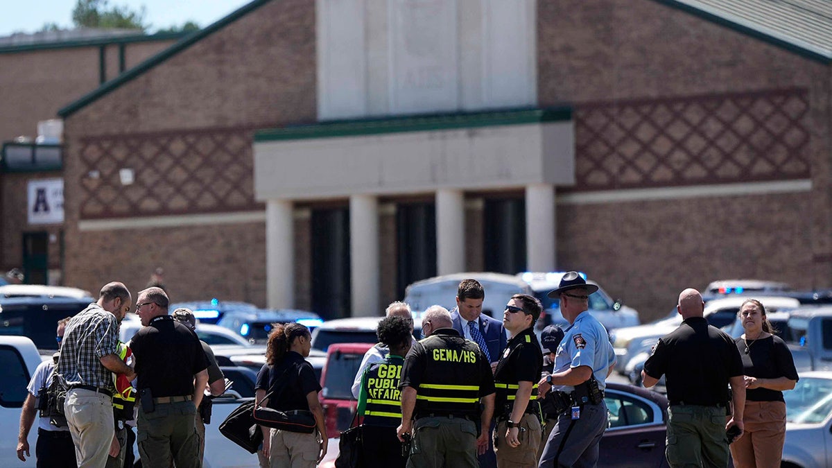 Police gather outside Apalachee High School after shooting at the school