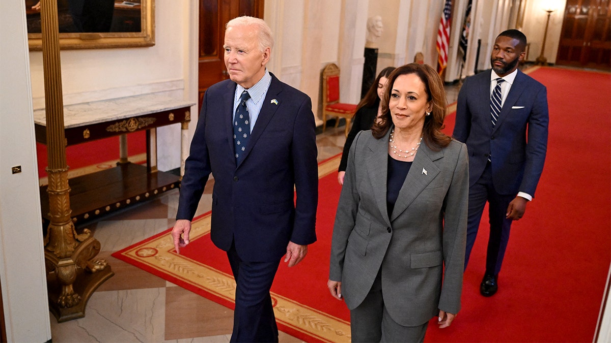 President Biden and Vice President Kamala Harris walk together in the White House