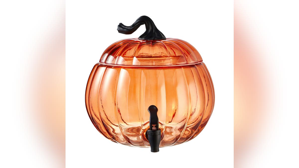 This pumpkin punch vessel  is made of glass.