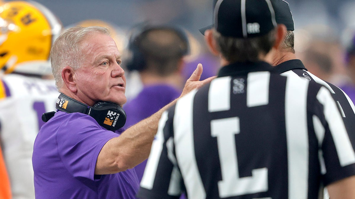 Brian Kelly talks to a referee