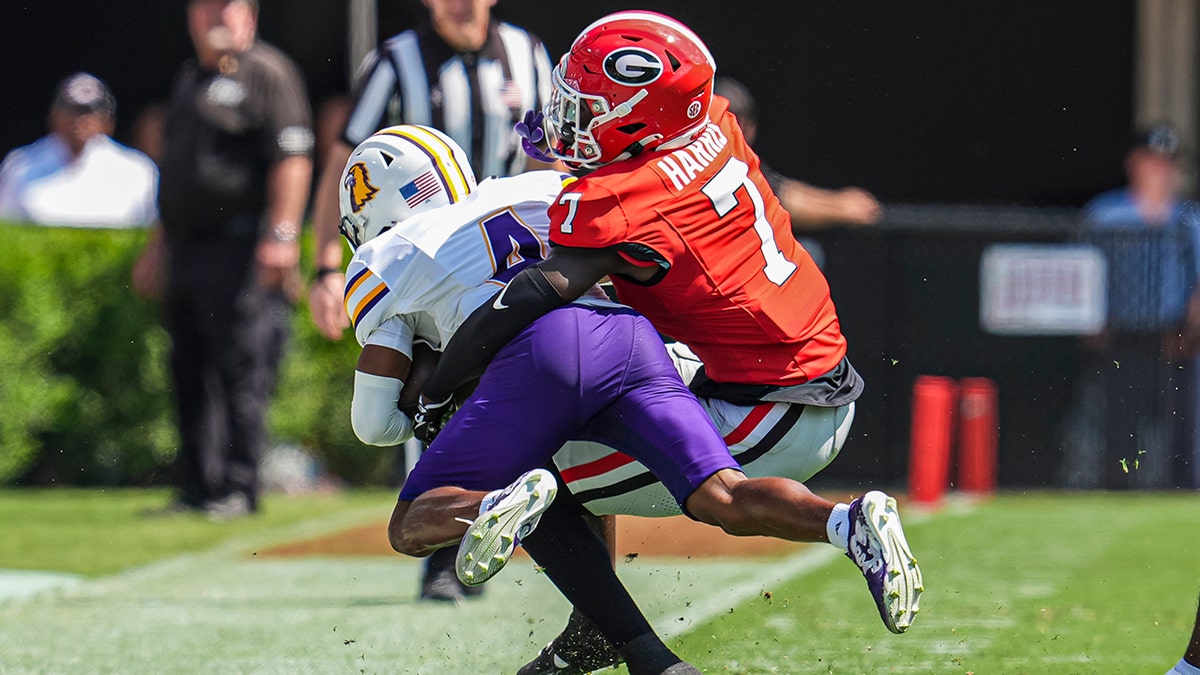 Daniel Harris makes a tackle