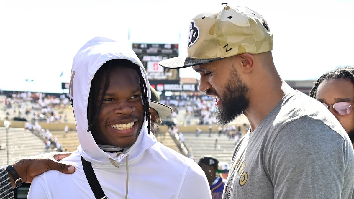 Derrick White speaks with Travis Hunter